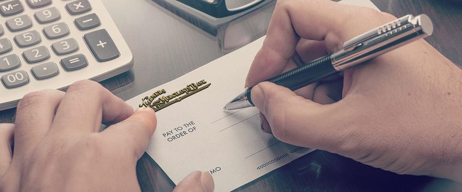 Person writing a check